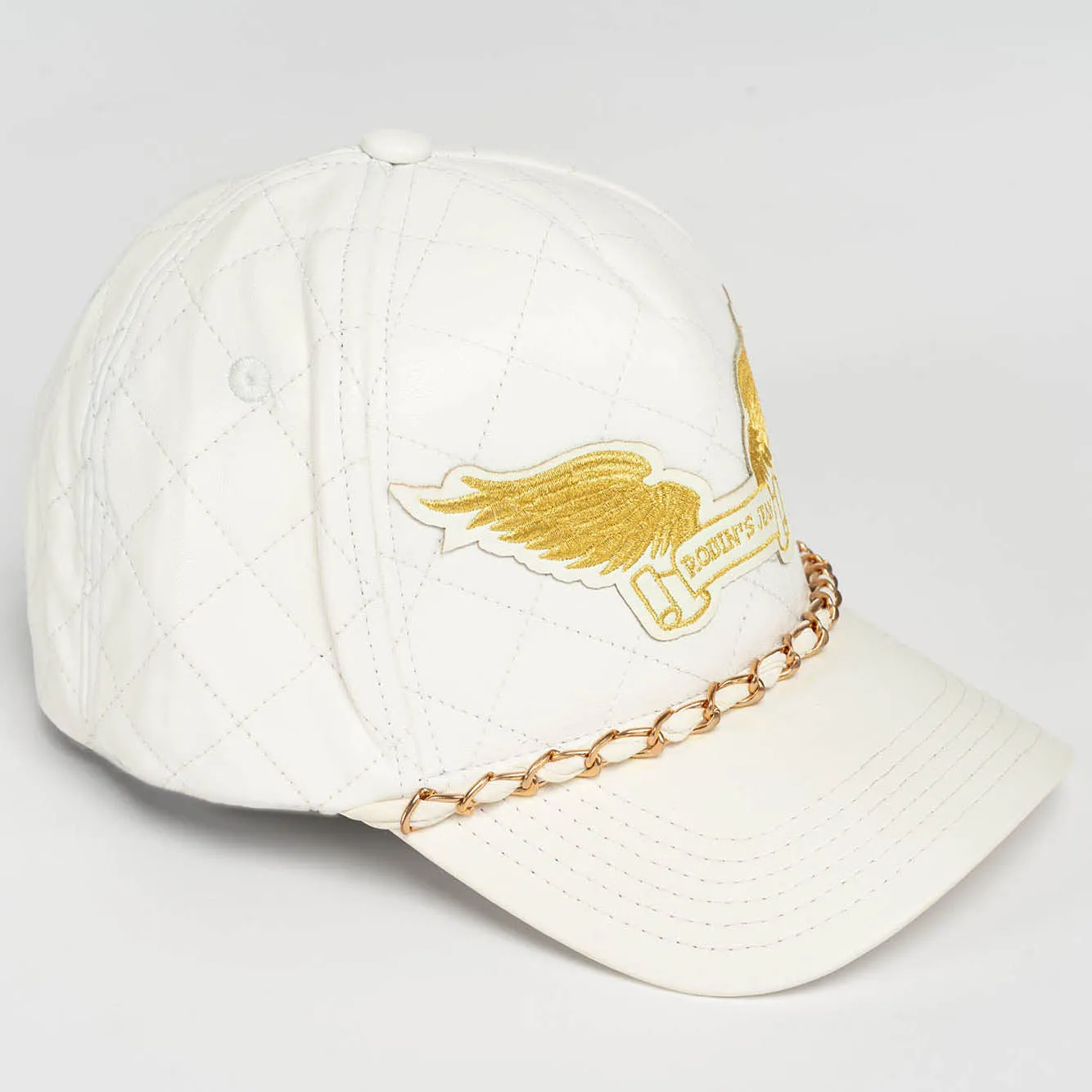 ROBINS LEATHER QUILTED CAP WITH GOLD WINGS STUDS AND COPPER CHAIN IN WHITE