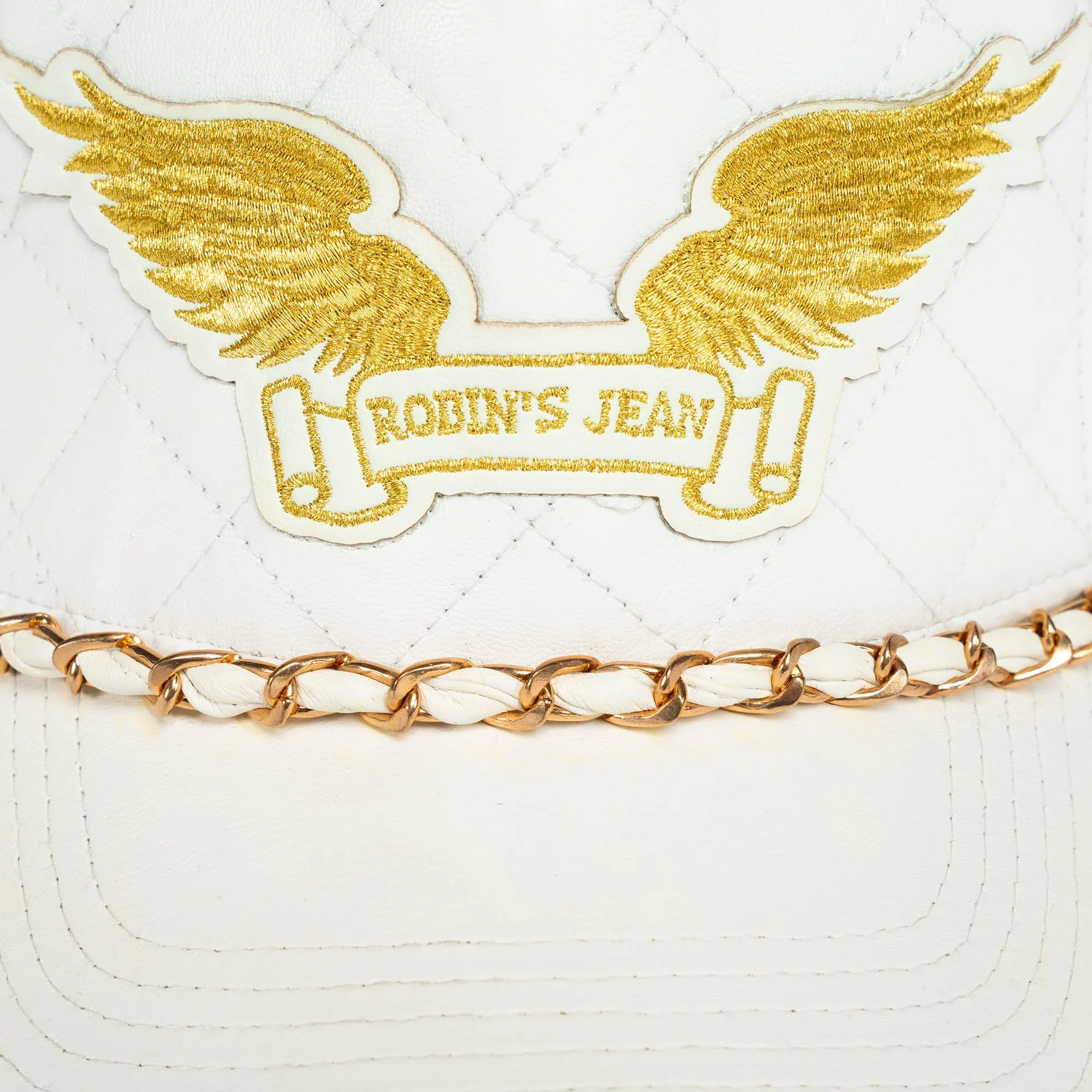 ROBINS LEATHER QUILTED CAP WITH GOLD WINGS STUDS AND COPPER CHAIN IN WHITE